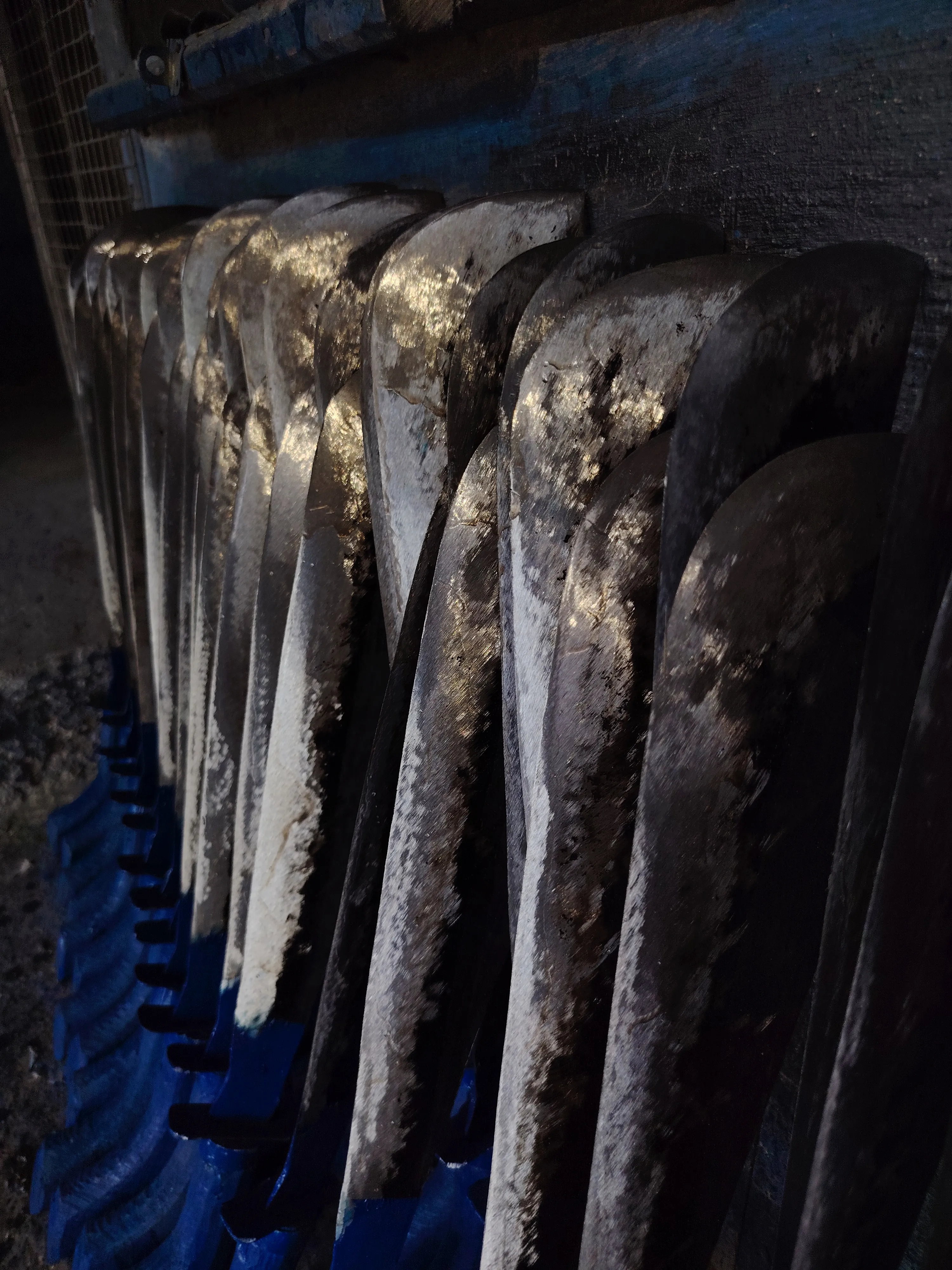 An image of row of blades from tools used as a background image for the hero section.